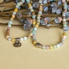 image:imageBivei 108 Mala Beads Necklace Long Beaded Wrap Bracelets Genuine Gemstone Mala Prayer Beads Lotus Buddha Charm Yoga Meditation NecklaceAmazoniteLotus OMBuddha