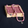 image:imageBivei 108 Mala Beads Necklace Long Beaded Wrap Bracelets Genuine Gemstone Mala Prayer Beads Lotus Buddha Charm Yoga Meditation NecklaceRhodochrositeLotus OMBuddha